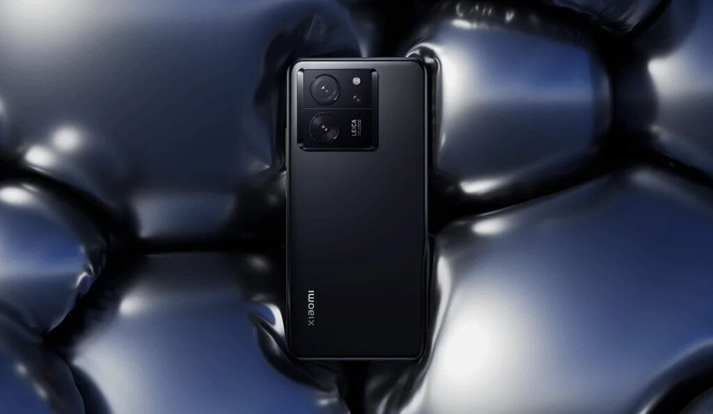 "Xiaomi smartphone with advanced camera module on reflective black surface"